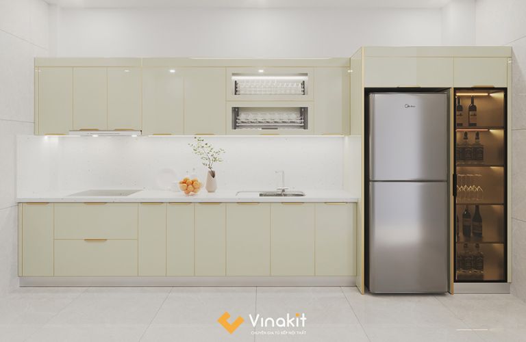 Tủ bếp chữ I màu kem sáng, bố trí gọn theo mảng tường, phù hợp với căn hộ studio hoặc bếp hành lang nhỏ.
